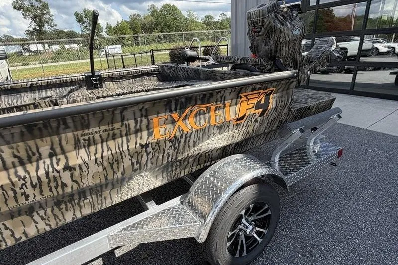 Slide: The Image of 2027 Excel 1754 Shallow Water F4 boat with camouflage design on a trailer. - 13