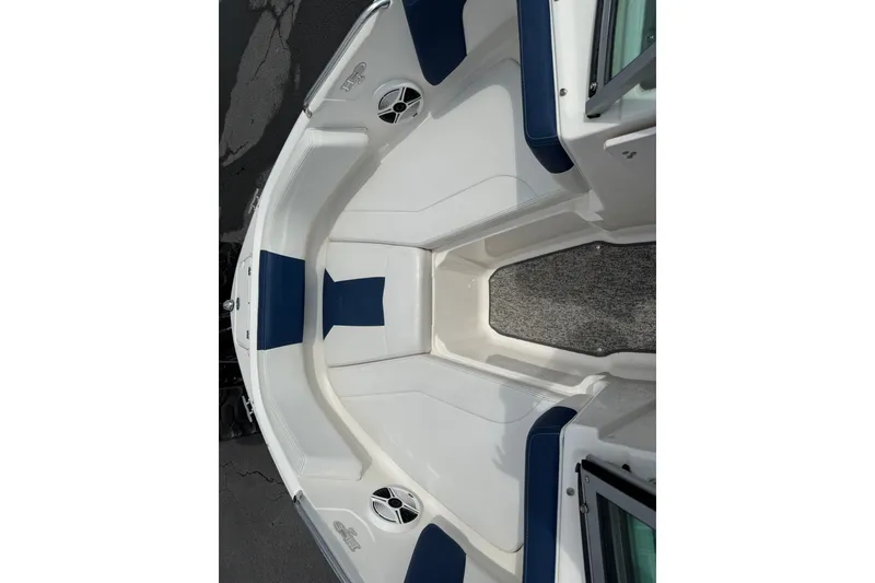 Slide: The Image of 2014 Chaparral 21 H2O Sport boat interior with blue and white seating. - 19