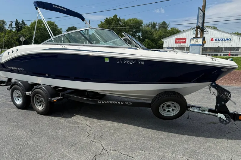 Slide: The Image of 2014 Chaparral 21 H2O Sport boat on trailer, parked outdoors. - 6