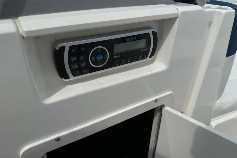 Slide: The Image of 2014 Chaparral 21 H2O Sport boat stereo system close-up. - 21