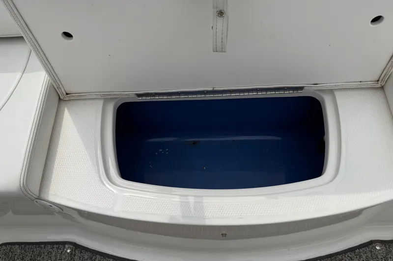 Slide: The Image of Open storage compartment on a 2014 Chaparral 21 H2O Sport boat. - 15