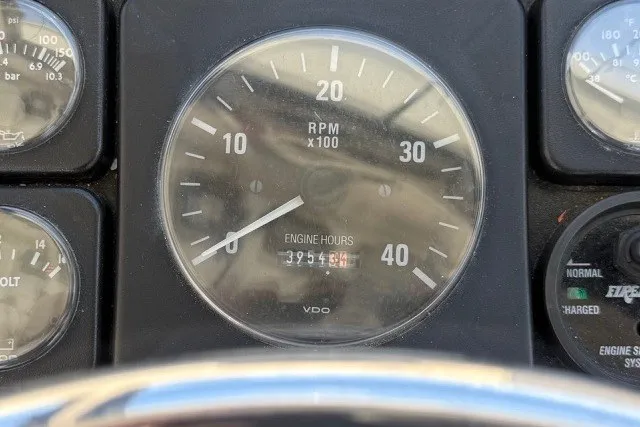 Slide: The Image of Close-up of Island Hopper Forward Cabin 2002 tachometer showing RPM and engine hours. - 6