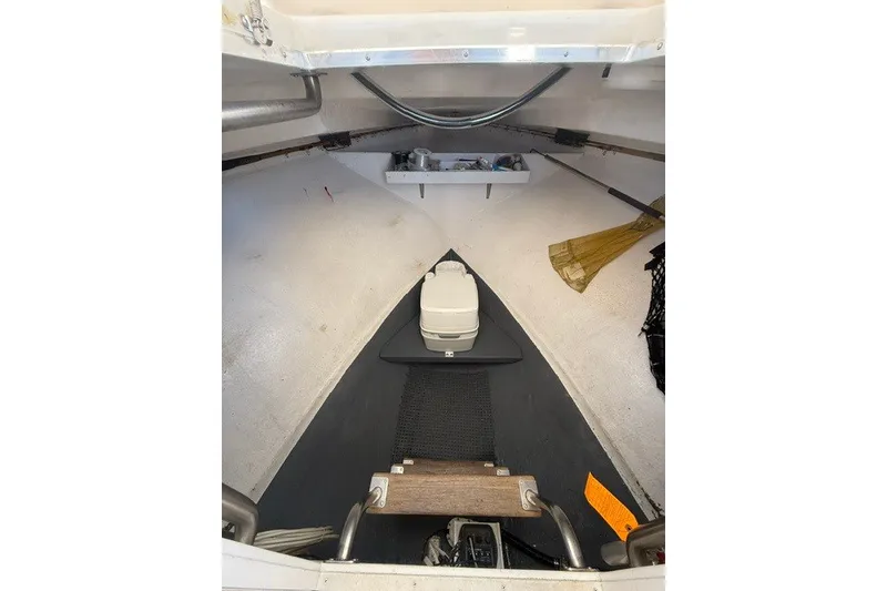 Slide: The Image of 2002 Island Hopper Forward Cabin interior with storage and equipment. - 11