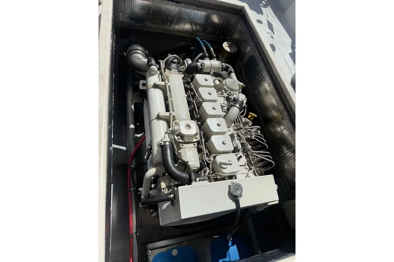 Slide: The Image of Engine compartment of a 2002 Island Hopper Forward Cabin boat, showcasing detailed machinery. - 5