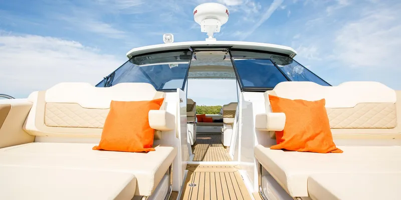 Slide: The Image of 2021 Aquila 36 Sport yacht interior with orange cushions and sleek design. - 15