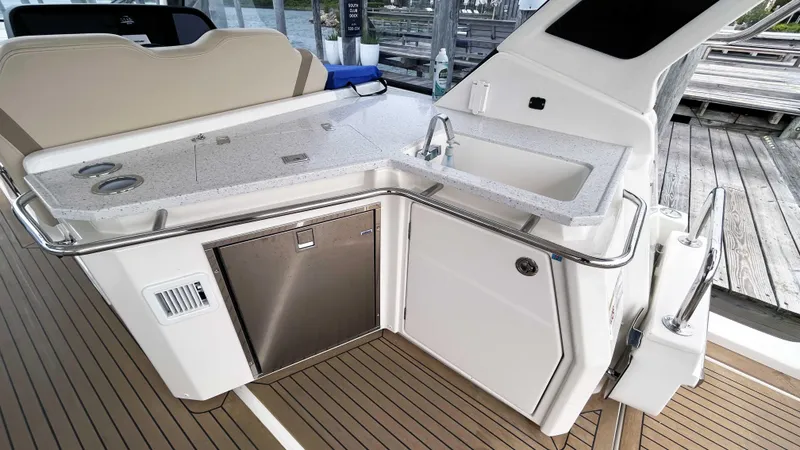 Slide: The Image of Aquila 36 Sport 2021 boat interior with sleek kitchenette and modern design. - 11