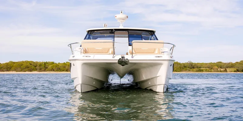 Slide: The Image of Aquila 36 Sport 2021 catamaran on water, front view, clear sky background. - 14