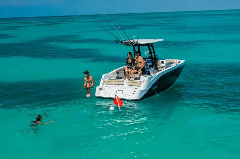 Slide: The Image of Yamaha 222 FSH Sport E 2026: Recreational boat in turquoise water with people on board and swimming. - 10