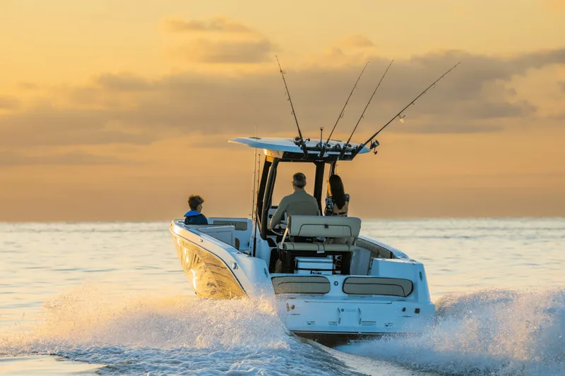 Slide: The Image of Yamaha 222 FSH Sport E 2026 cruising on water at sunset. - 1