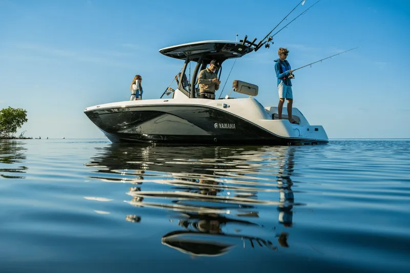 Slide: The Image of Yamaha 222 FSH Sport E 2026: A modern boat with anglers on calm water. - 7