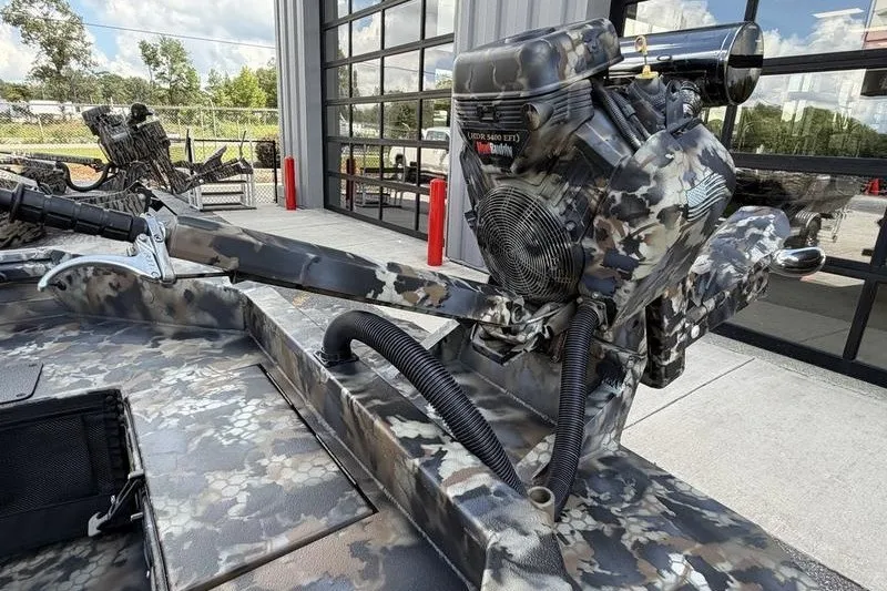 Slide: The Image of 2027 Excel 1754 Shallow Water F4 boat with camo design and powerful engine. - 12
