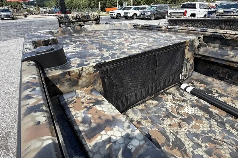 Slide: The Image of 2027 Excel 1754 Shallow Water F4 boat with camouflage design in parking lot. - 16