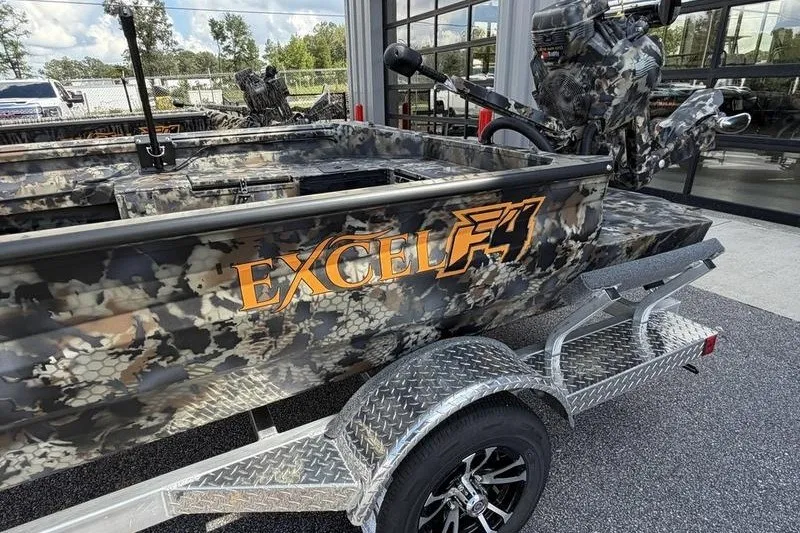 Slide: The Image of 2027 Excel 1754 Shallow Water F4 boat with camouflage design on a trailer. - 22