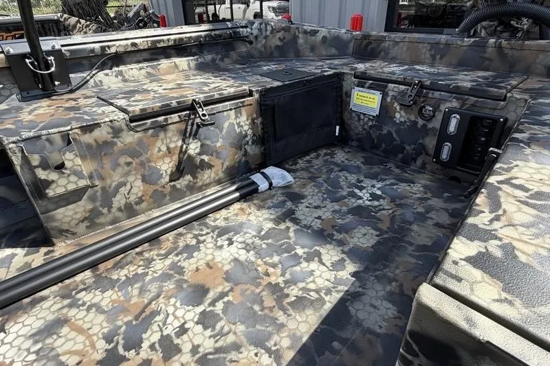 Slide: The Image of 2027 Excel 1754 Shallow Water F4 boat interior with camouflage design and storage compartments. - 11