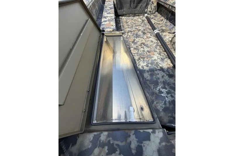 Slide: The Image of 2027 Excel 1754 Shallow Water F4 boat interior with open storage compartment. - 10