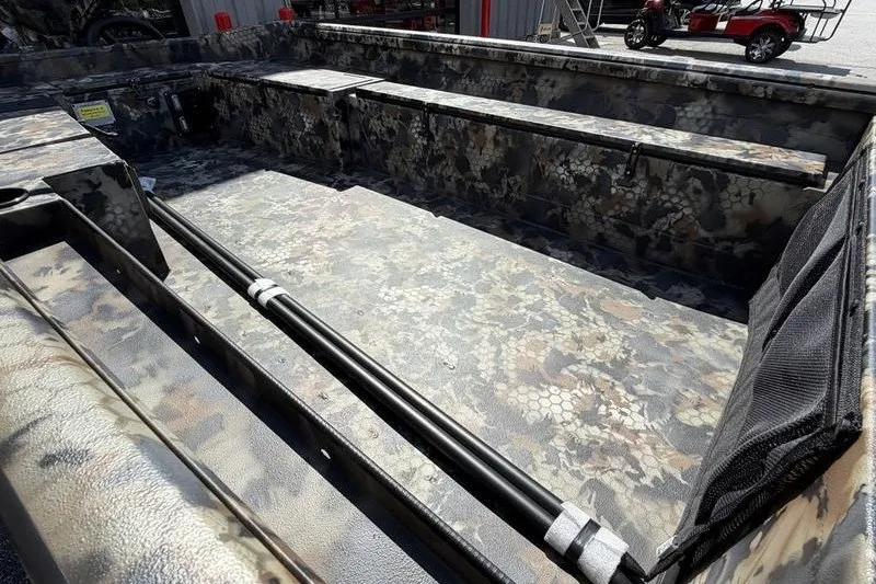 Slide: The Image of 2027 Excel 1754 Shallow Water F4 boat interior with camouflage design, showcasing spacious layout. - 17