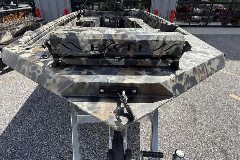 Slide: The Image of 2027 Excel 1754 Shallow Water F4 boat with camouflage design on display. - 6