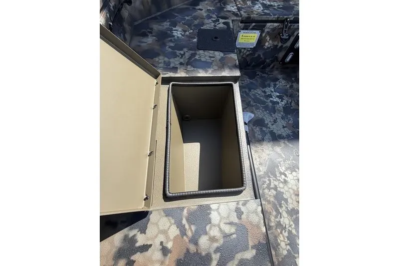 Slide: The Image of Open storage compartment in 2027 Excel 1754 Shallow Water F4 boat, camo interior design. - 4