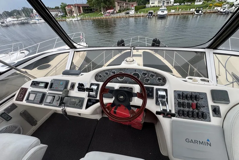 Slide: The Image of Cockpit view of a 1998 Sea Ray 420 Aft Cabin yacht with Garmin navigation. - 7