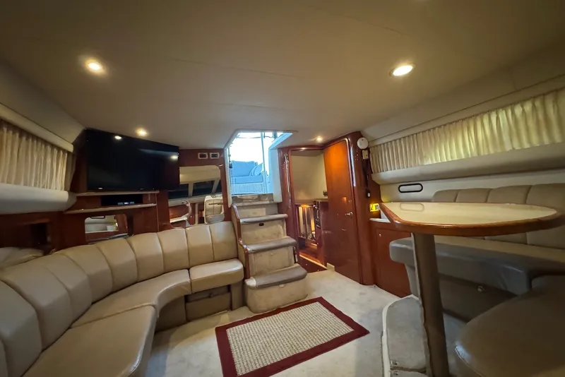 Slide: The Image of Luxurious interior of 1998 Sea Ray 420 Aft Cabin yacht with plush seating and elegant decor. - 20