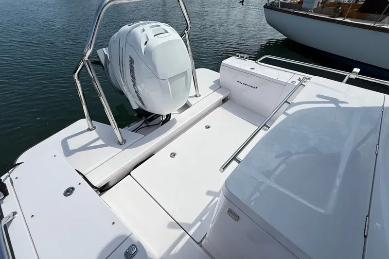 Slide: The Image of 2022 Axopar 28 Cabin boat with Mercury outboard engine on calm water. - 10