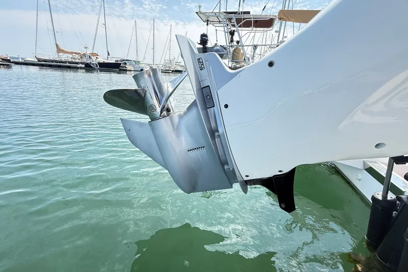 Slide: The Image of Outboard motor of 2022 Axopar 28 Cabin boat docked in marina. - 8