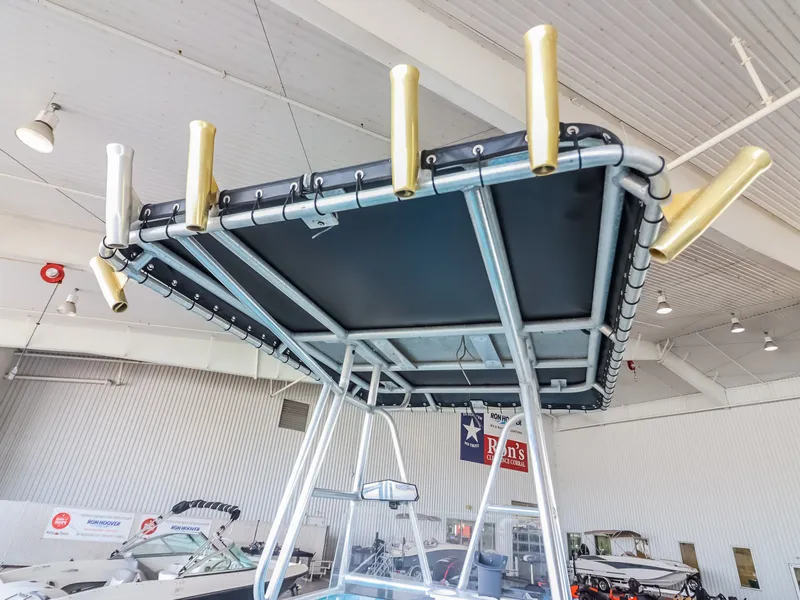 Slide: The Image of A boat roof with multiple fishing rod holders in a showroom. - 19