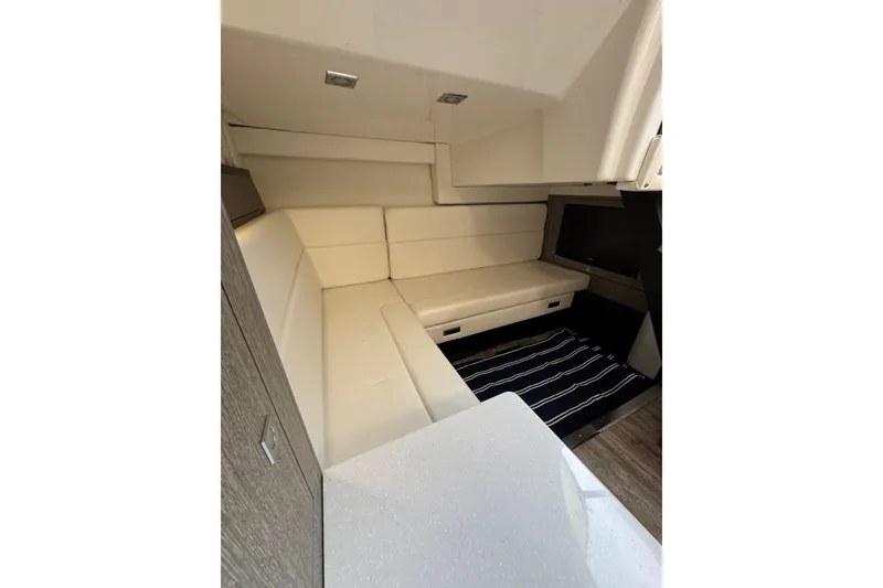 Slide: The Image of Interior of 2021 Monterey 335 Sport Yacht with modern seating and sleek design. - 35