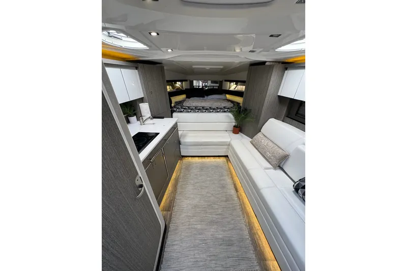 Slide: The Image of Luxurious interior of 2021 Monterey 335 Sport Yacht with modern furnishings and ambient lighting. - 24