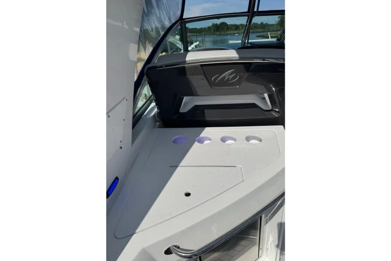 Slide: The Image of Interior view of 2021 Monterey 335 Sport Yacht, featuring sleek design and cup holders. - 57