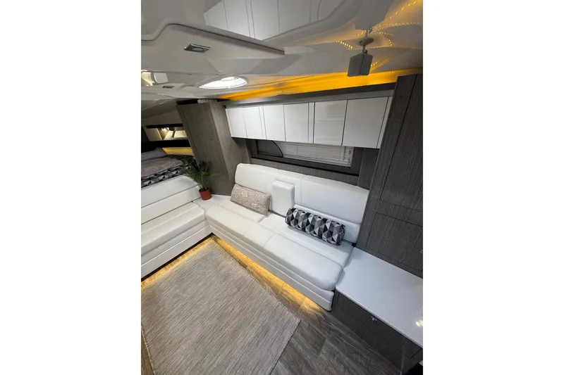 Slide: The Image of Luxurious interior of 2021 Monterey 335 Sport Yacht with modern seating and ambient lighting. - 25