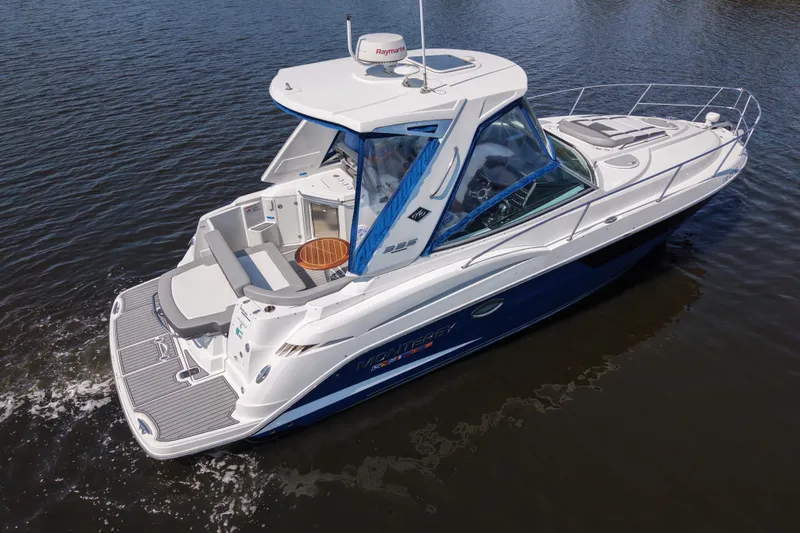 Slide: The Image of 2021 Monterey 335 Sport Yacht cruising on calm waters, showcasing sleek design and luxury features. - 10