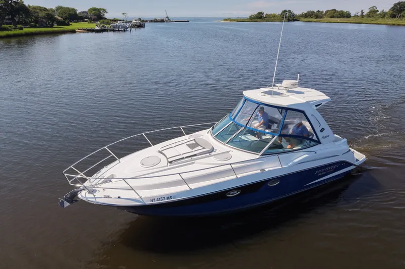 Slide: The Image of 2021 Monterey 335 Sport Yacht cruising on a calm river. - 20