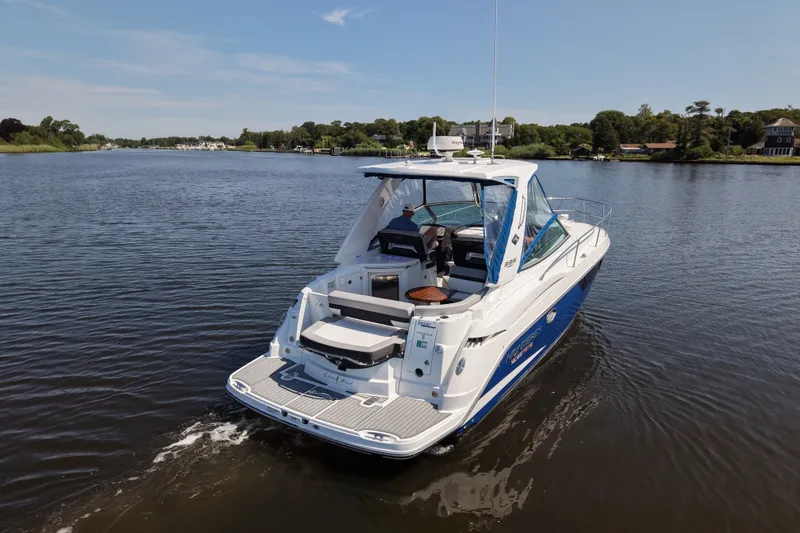 Slide: The Image of 2021 Monterey 335 Sport Yacht cruising on a serene river. - 14