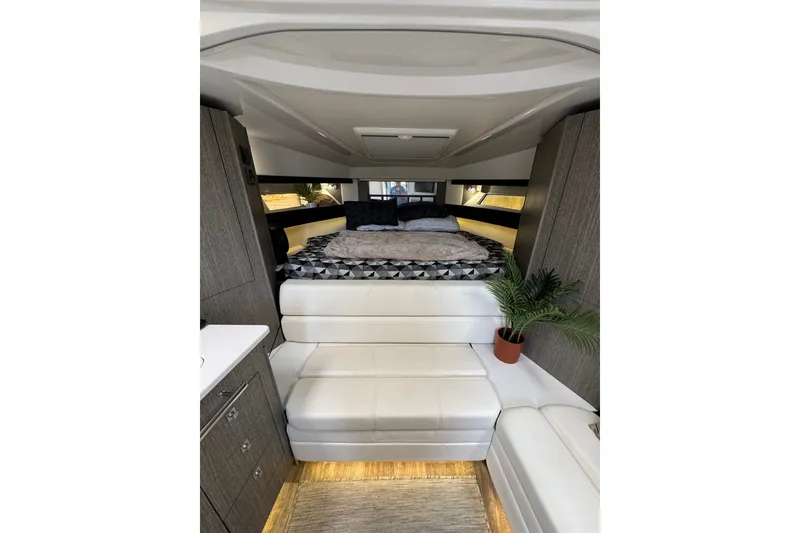 Slide: The Image of Luxurious interior of 2021 Monterey 335 Sport Yacht with modern furnishings and cozy bed. - 32
