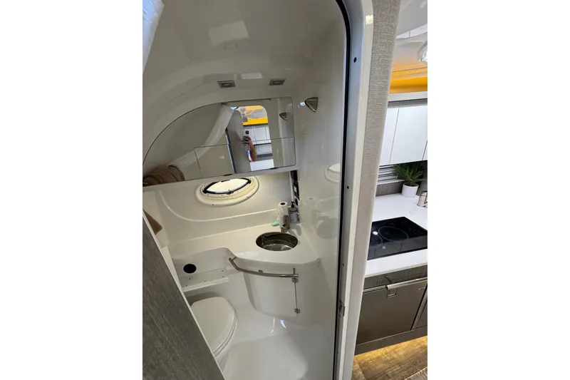 Slide: The Image of 2021 Monterey 335 Sport Yacht bathroom with modern fixtures and compact design. - 41