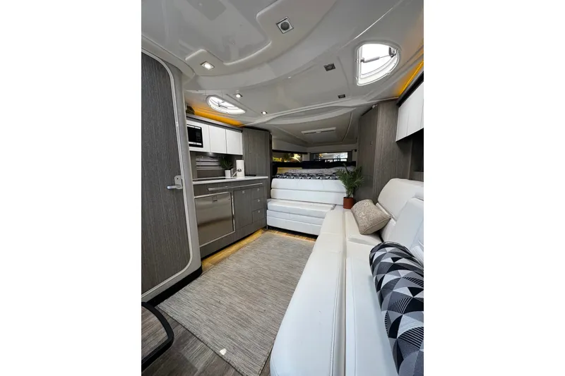 Slide: The Image of Luxurious interior of 2021 Monterey 335 Sport Yacht with modern kitchen and seating area. - 40