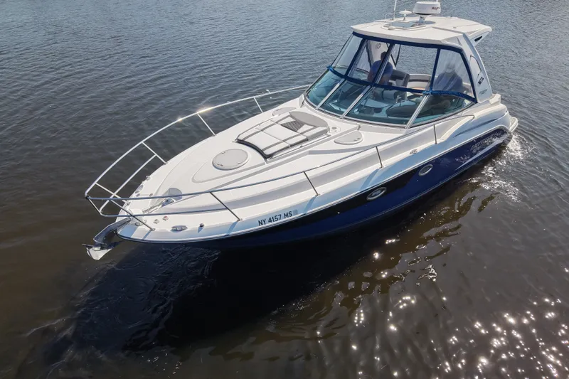 Slide: The Image of 2021 Monterey 335 Sport Yacht cruising on calm waters, showcasing sleek design and luxury features. - 12