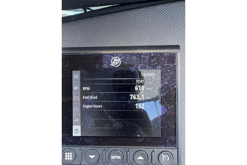 Slide: The Image of Dashboard display of a 2021 Monterey 335 Sport Yacht showing RPM, fuel used, and engine hours. - 49