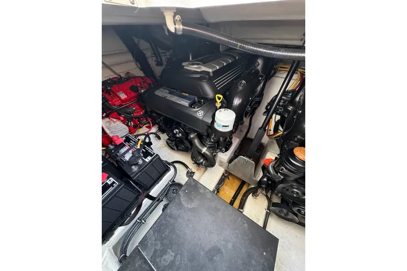 Slide: The Image of Engine compartment of a 2021 Monterey 335 Sport Yacht, showcasing mechanical components. - 65