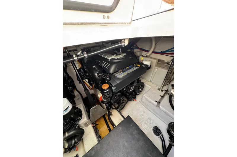 Slide: The Image of Engine compartment of 2021 Monterey 335 Sport Yacht, showcasing detailed mechanical components. - 66