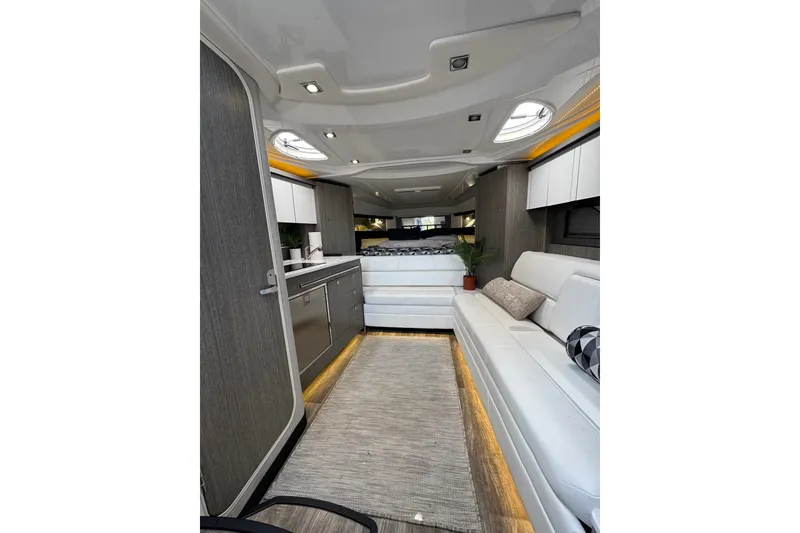 Slide: The Image of Luxurious interior of a 2021 Monterey 335 Sport Yacht with modern furnishings and ambient lighting. - 39