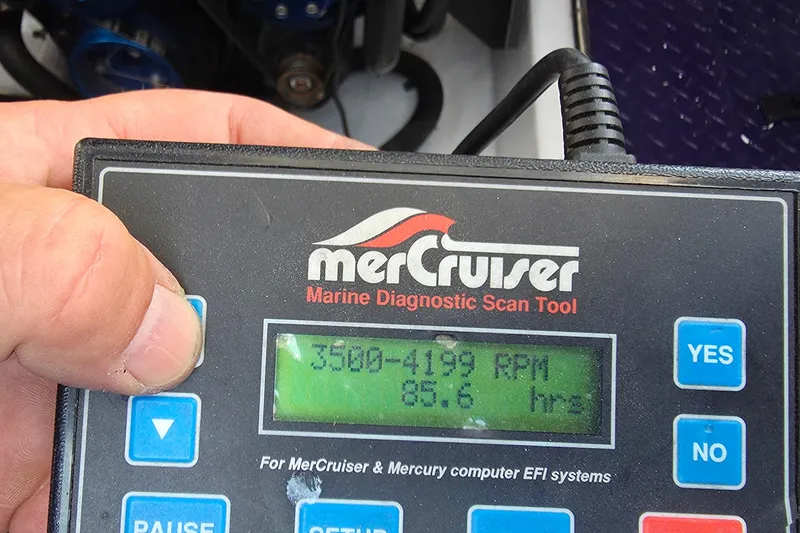 Slide: The Image of MerCruiser diagnostic tool displaying RPM and hours for 2006 Donzi 38 ZR boat. - 21
