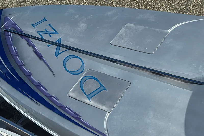 Slide: The Image of 2006 Donzi 38 ZR boat with sleek design and vibrant graphics. - 11