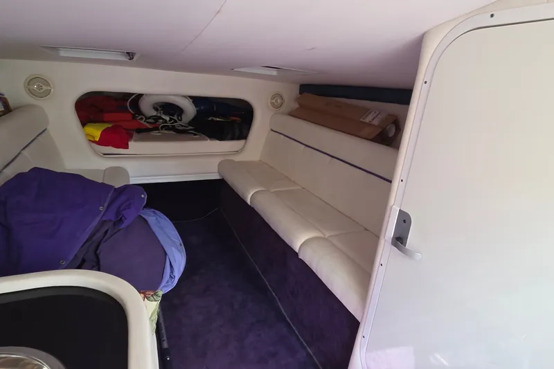 Slide: The Image of Interior cabin of a 2006 Donzi 38 ZR boat with seating and storage. - 35