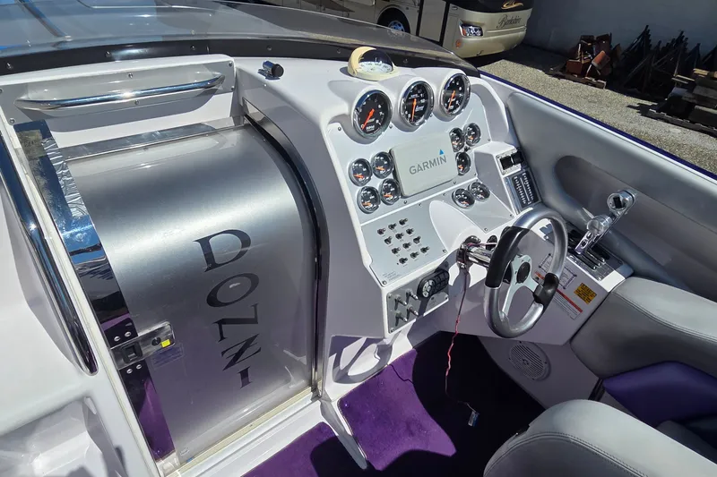 Slide: The Image of Cockpit of 2006 Donzi 38 ZR boat with Garmin navigation and sleek controls. - 3
