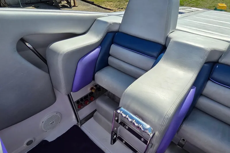 Slide: The Image of Interior seating of 2006 Donzi 38 ZR boat with gray and purple upholstery. - 32