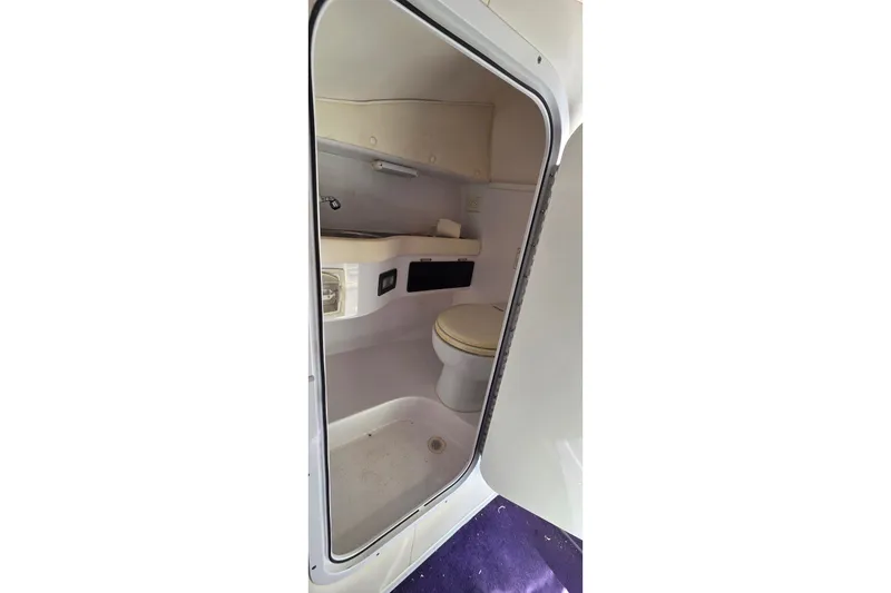 Slide: The Image of Interior view of a 2006 Donzi 38 ZR boat bathroom with toilet and sink. - 26