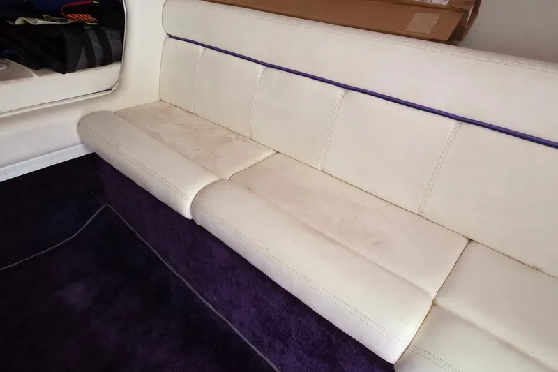 Slide: The Image of Interior seating of a 2006 Donzi 38 ZR boat with white upholstery. - 37