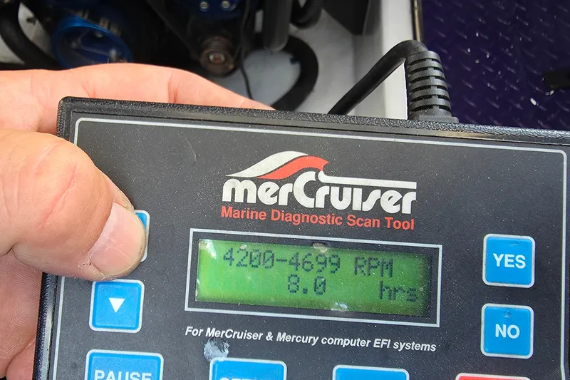 Slide: The Image of MerCruiser diagnostic tool displaying RPM and hours for 2006 Donzi 38 ZR boat. - 20